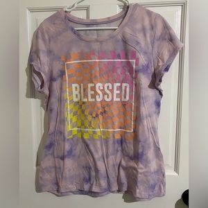Women’s t-shirt with blessed written on it. Says it’s a 3x fits like a medium.